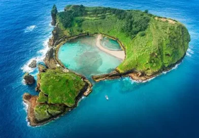 Azores Portugal Atlantic Archipelago — volcanic crater island with turquoise lagoon and lush green cliffs