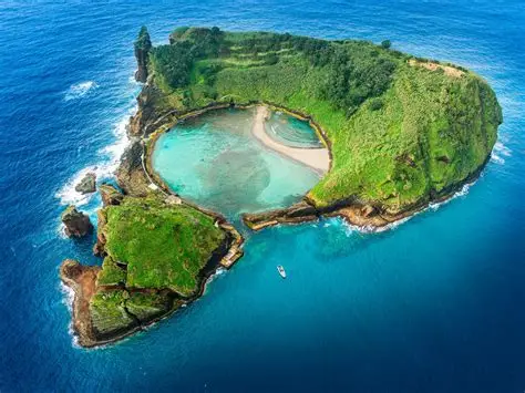 Azores Portugal Atlantic Archipelago — volcanic crater island with turquoise lagoon and lush green cliffs