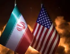 The flags of Iran and the United States displayed side by side against a fiery, glowing background symbolizing rising geopolitical tension.