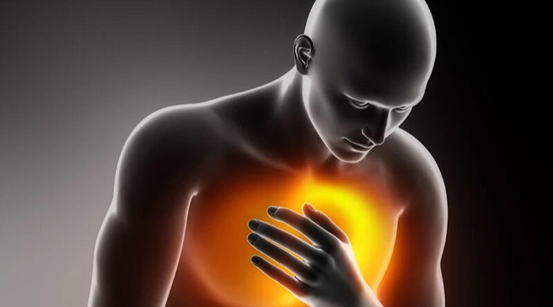 A person holding their chest as a bright glow highlights the heart area, symbolizing stress‑related chest pain and the hidden impact of emotional pressure on the body.
