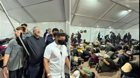 Handcuffed activists kneeling inside a detention tent during the Flotilla operation, surrounded by security forces