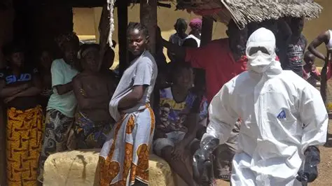 Ebola outbreak Congo field response Ebola outbreak Congo health worker in protective suit during field response