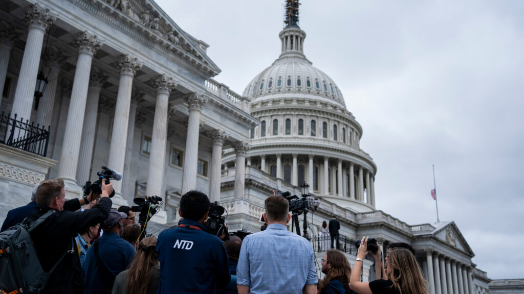 U.S. Congress budget negotiations 2026 outside the Capitol with journalists covering political developments
