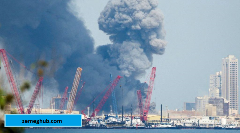 Thick smoke rising over a port city after a major industrial fire