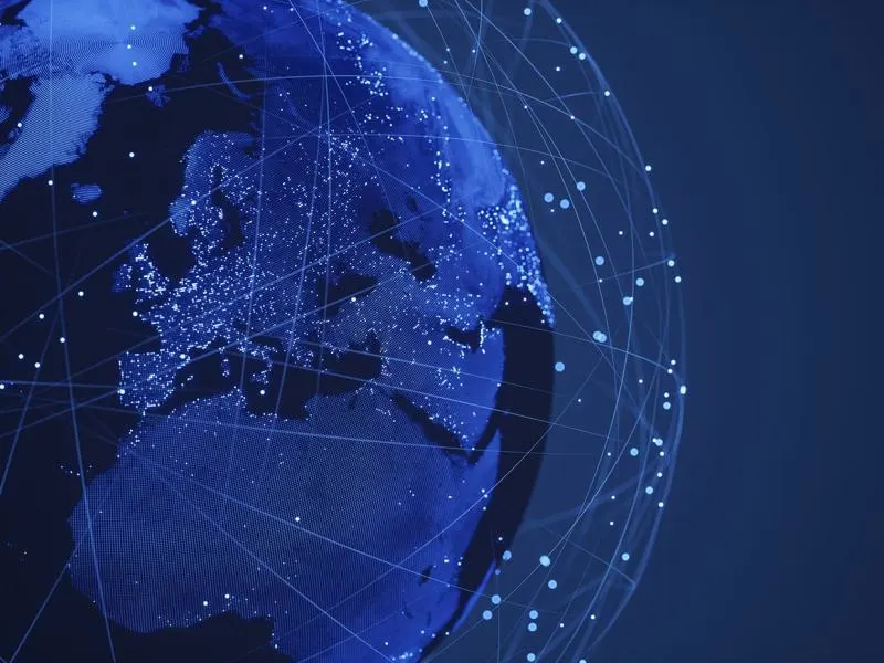 Big Tech antitrust regulation represented through a digital globe with interconnected data networks.