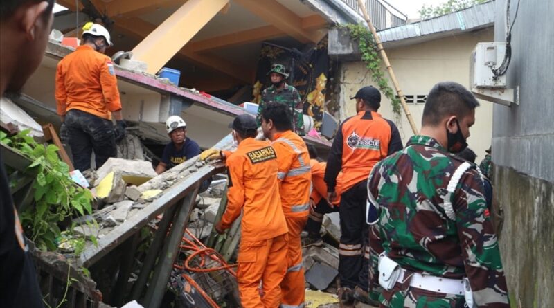 Philippines earthquake 2026 rescue teams searching through collapsed building debris.