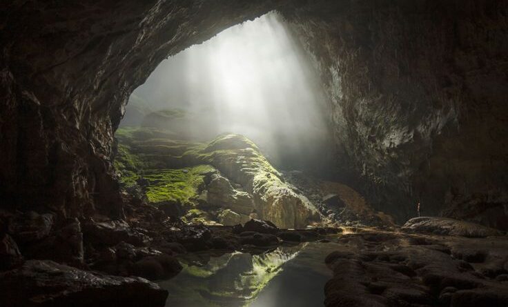 breathing caves illuminated by natural sunlight inside a deep cavern
